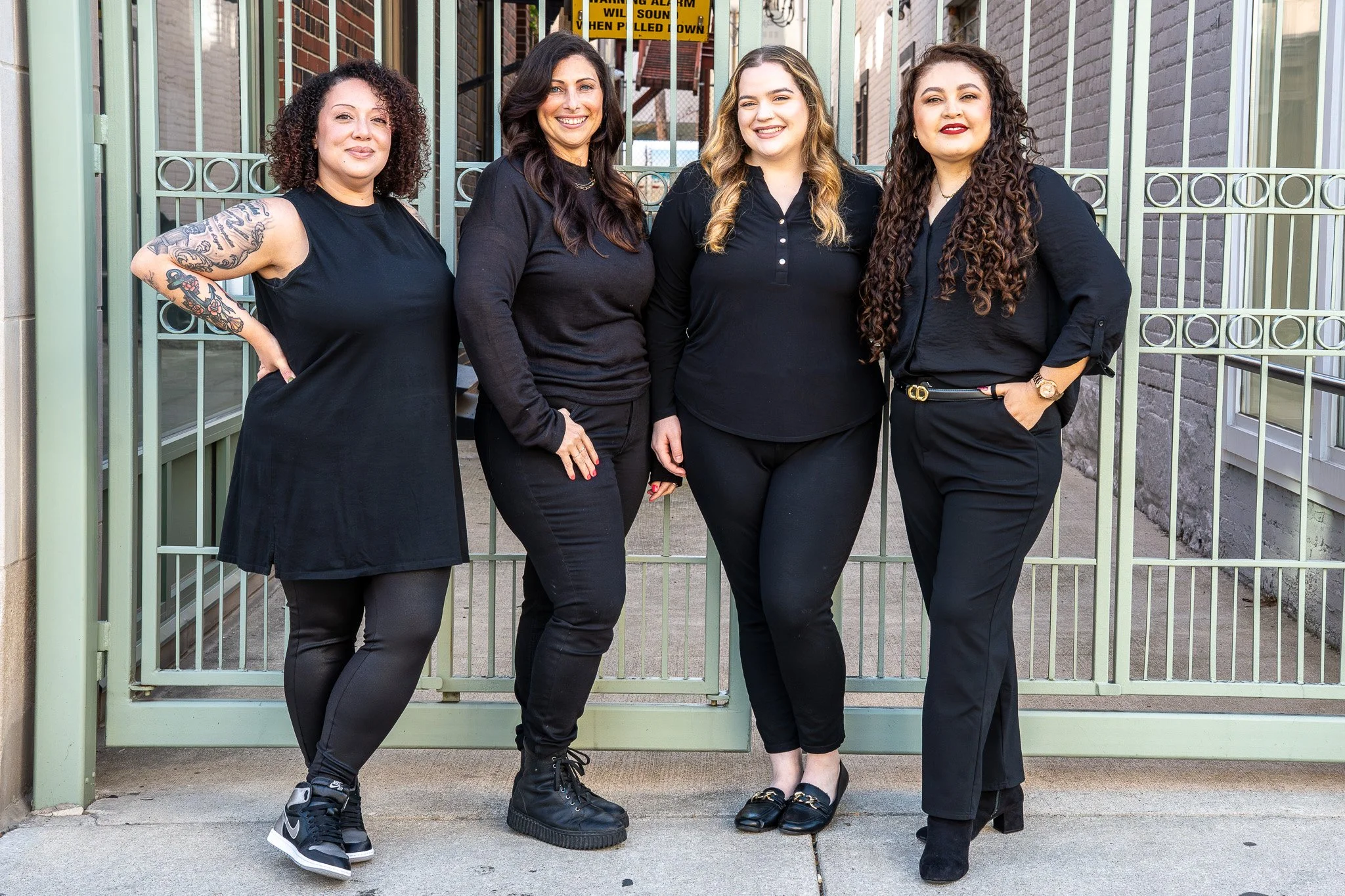 The Pura Vida Color Studio Hair Salon team on the fire escape